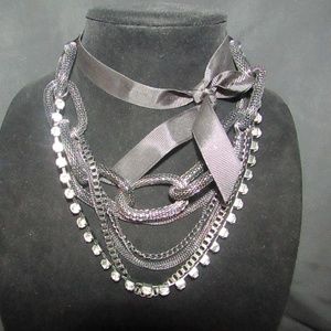 Ribbon, rhinestone and chain fashion necklace.